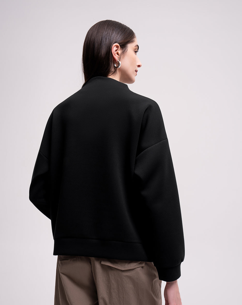 Buzo confort cuello alto tacto suave negro mujer