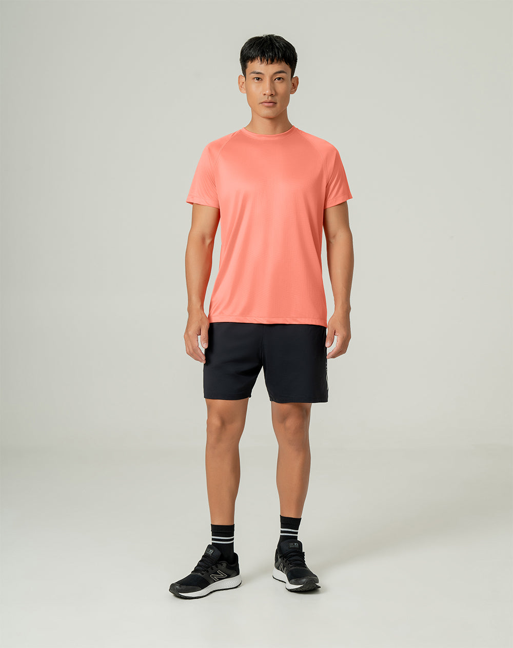 Camiseta deportiva hombre control humedad naranja