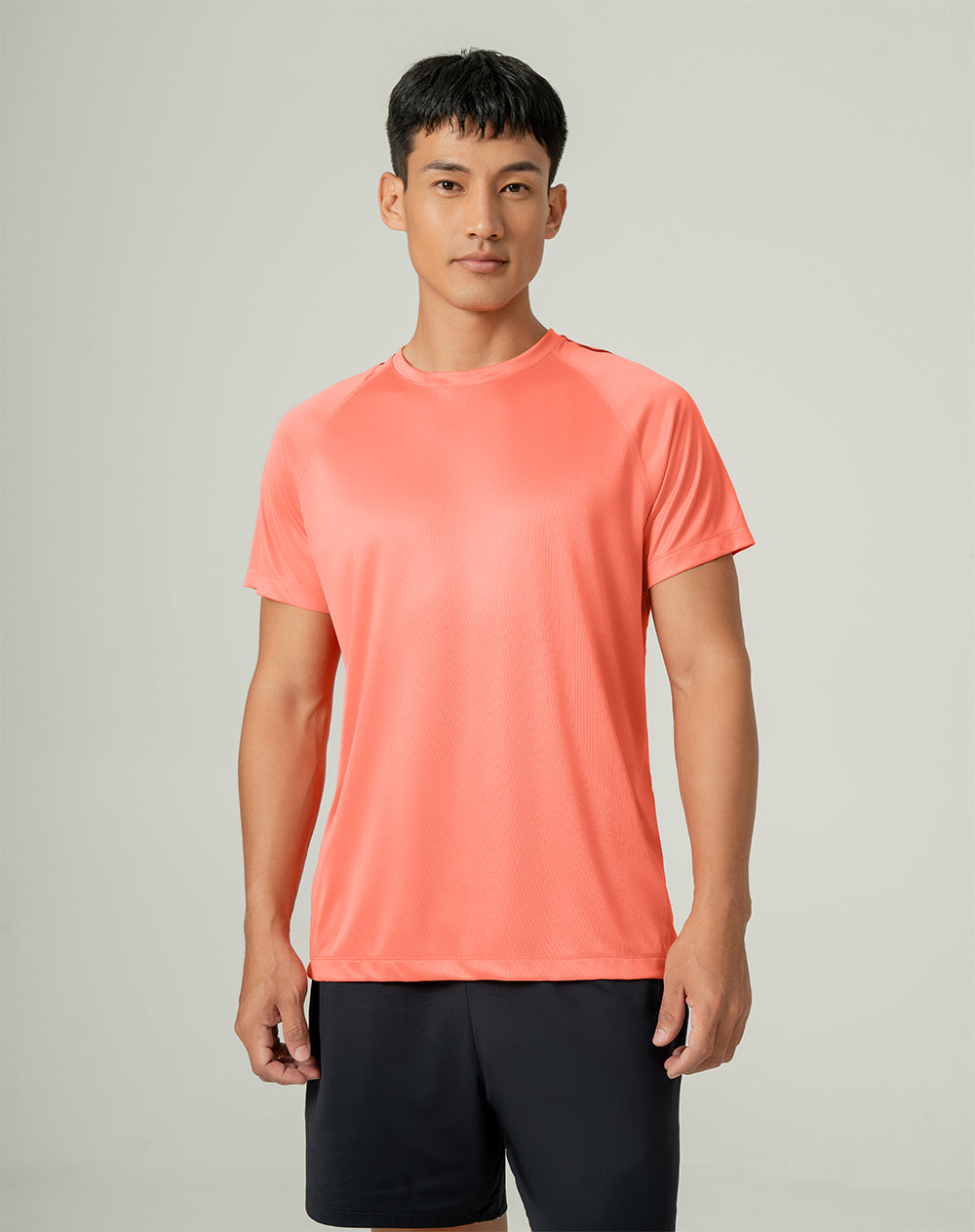 Camiseta deportiva hombre control humedad naranja