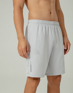 Pantaloneta deportiva control humedad gris hombre