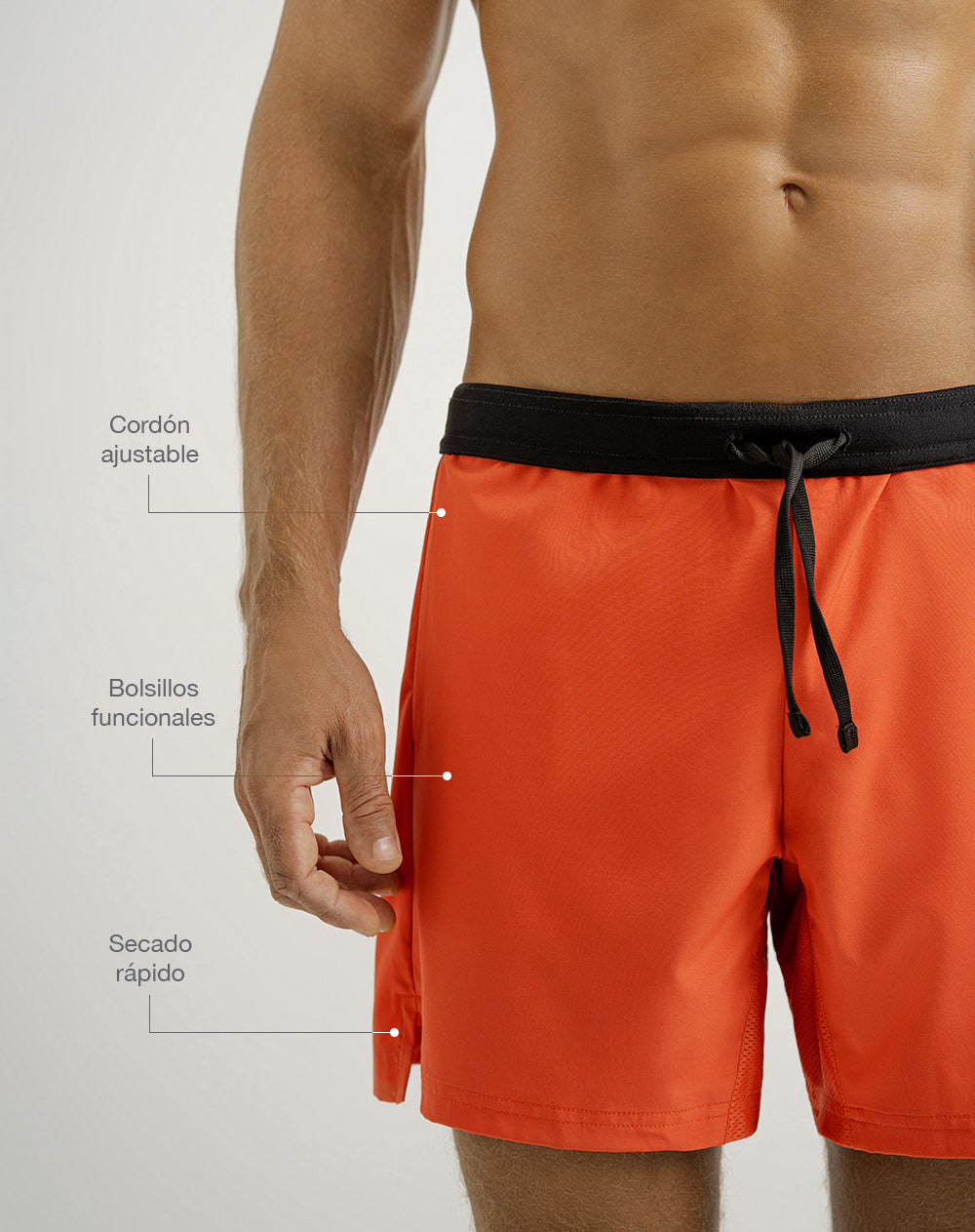 Pantaloneta deportiva malla interna naranja hombre