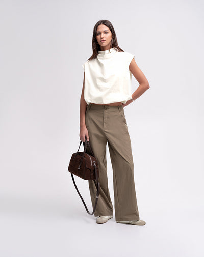 Blusa cuello tortuga con cierre vainilla mujer