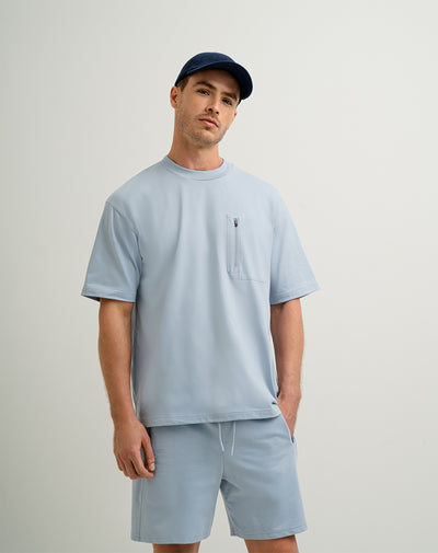 Camiseta en algodón sostenible bolsillo frontal con cierre azul para hombre