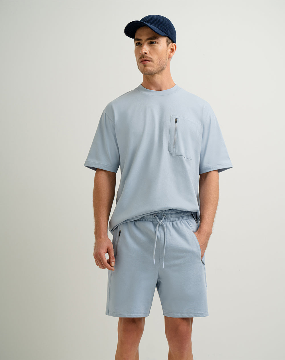 Camiseta en algodón sostenible bolsillo frontal con cierre azul para hombre