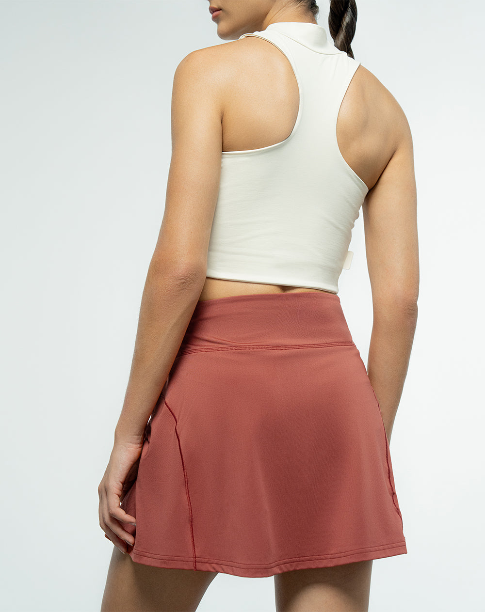 Falda de tenis ciclista interno terracota para mujer