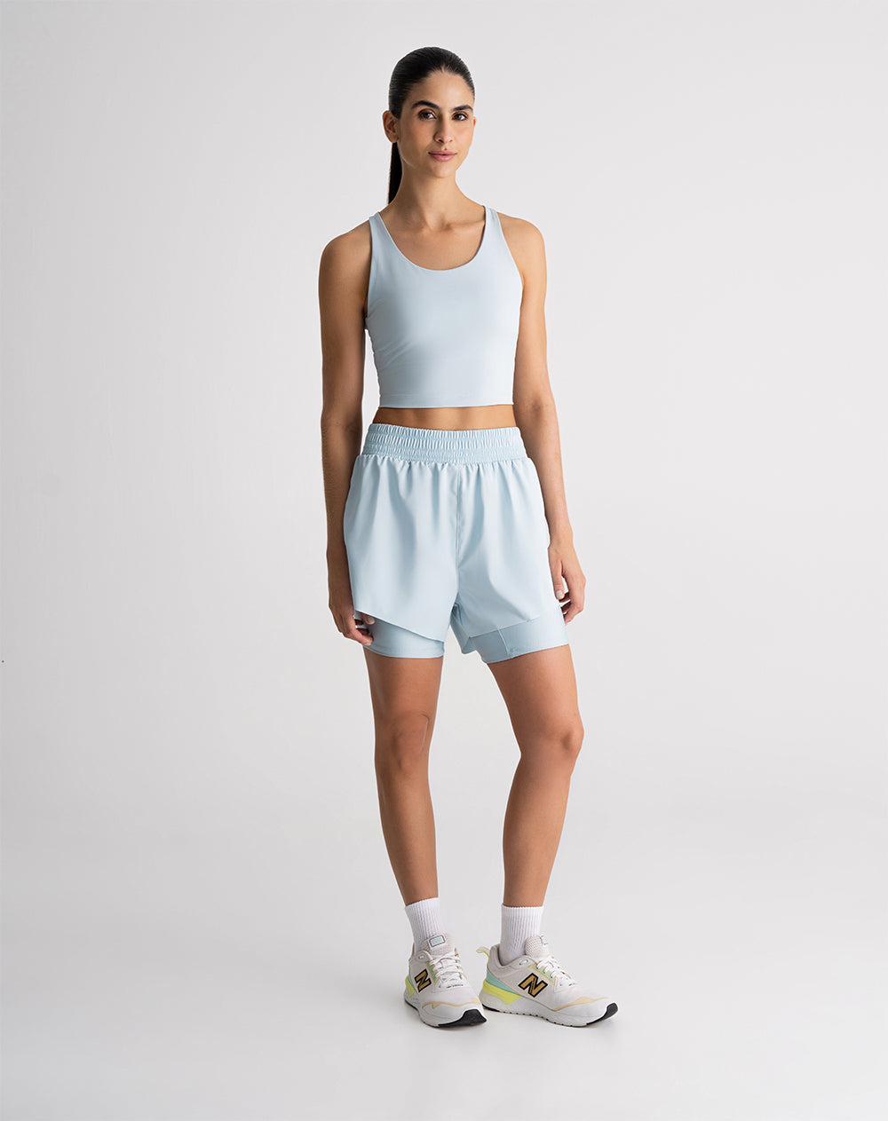 Top deportivo soporte medio control humedad azul