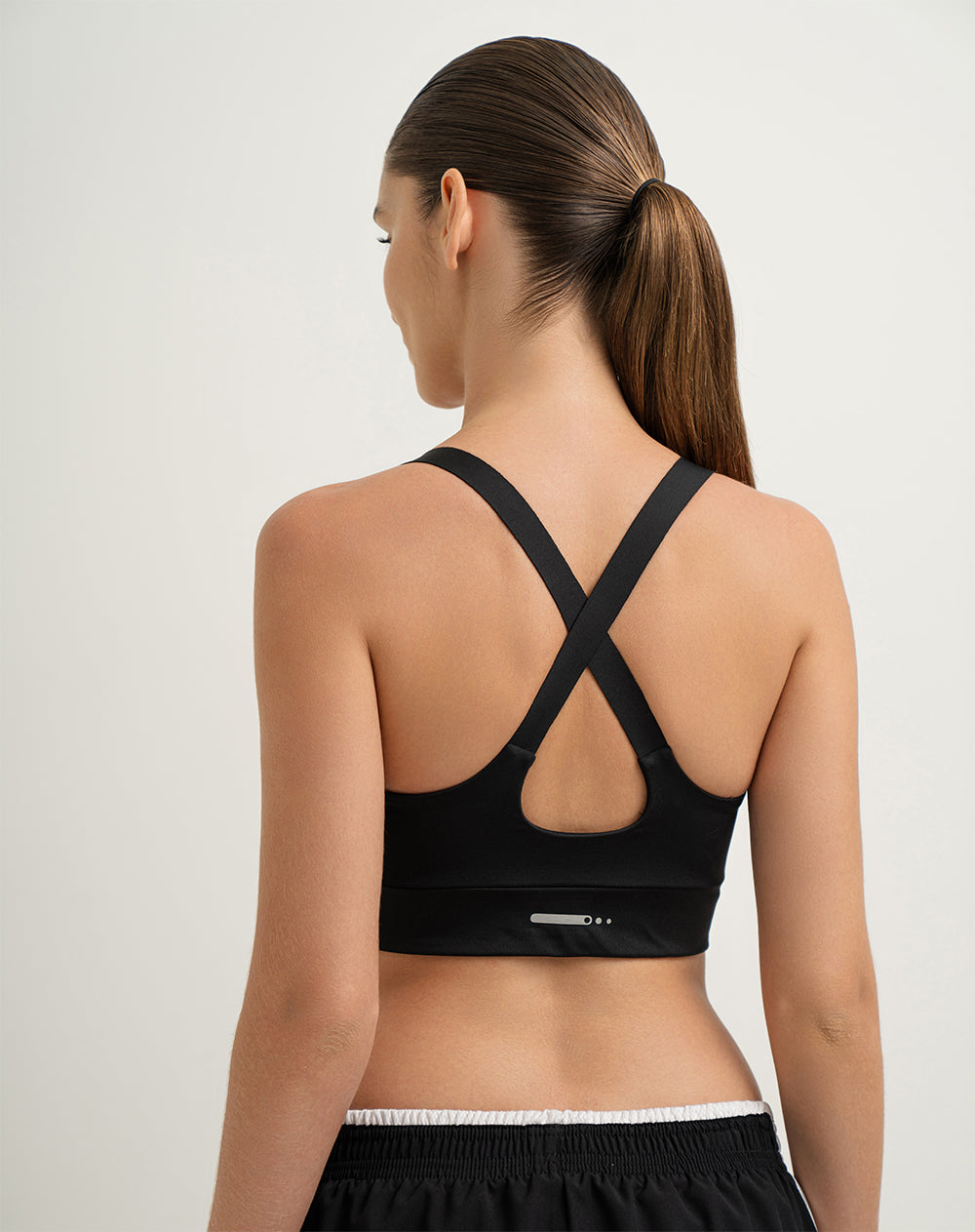 Top deportivo soporte alto sin costura con control humedad negro