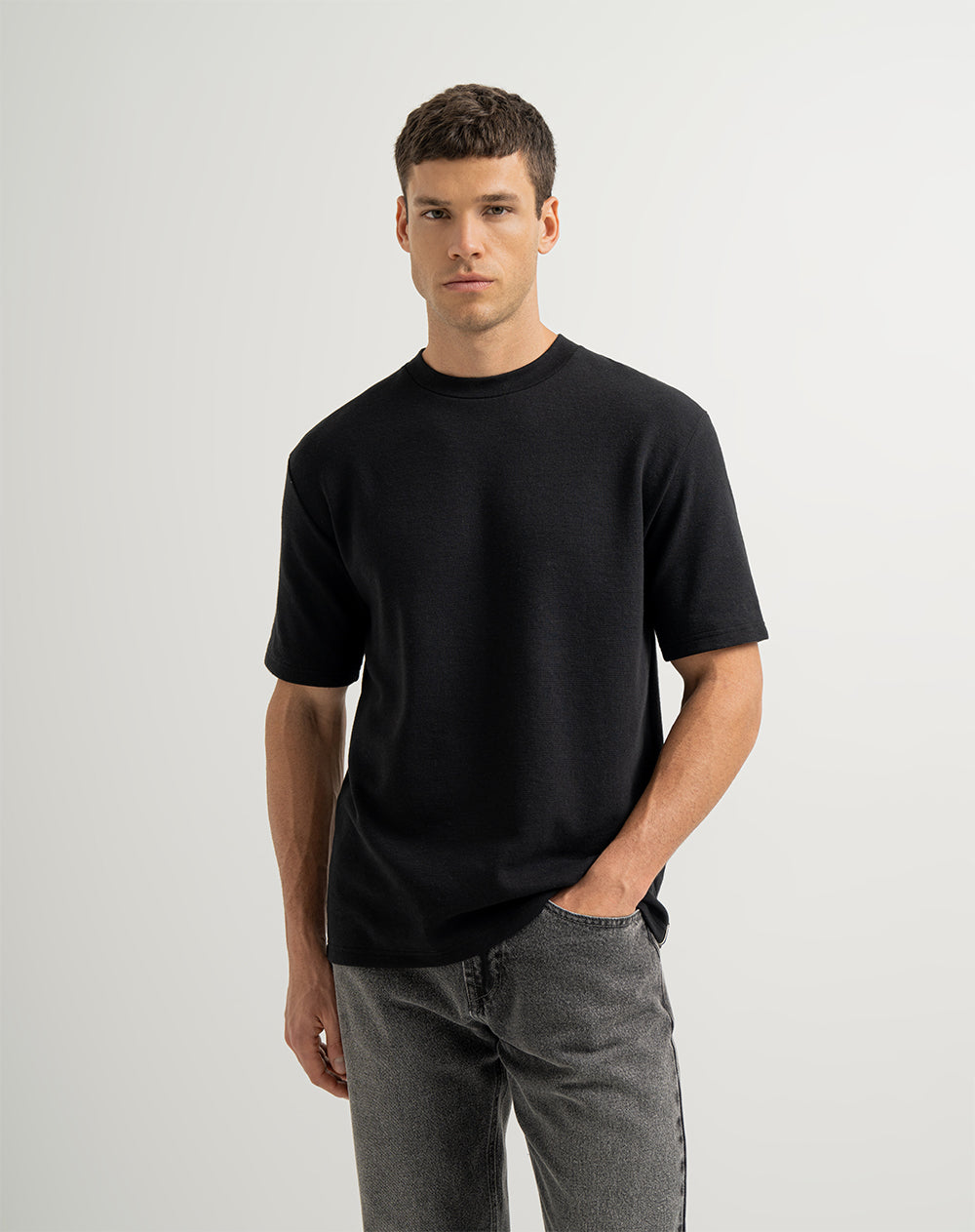 Camiseta oversized fit en tela con textura manga corta negra