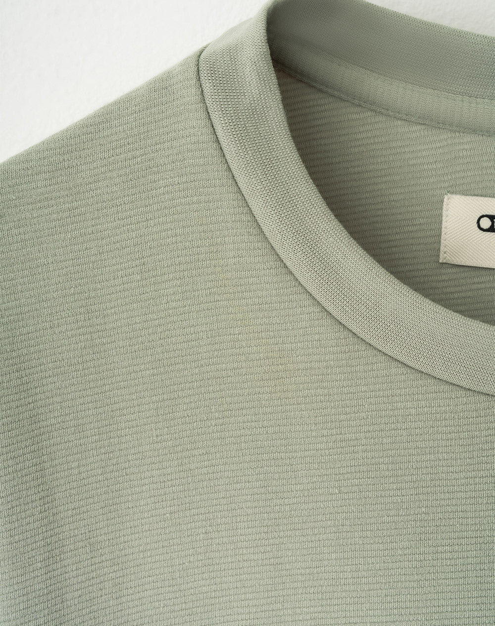 Camiseta oversized fit en tela con textura manga corta verde