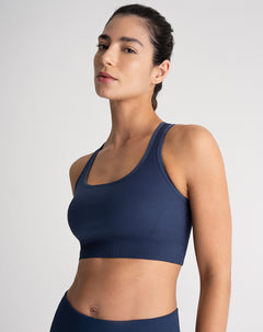 Top deportivo soporte alto control humedad azul