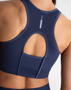 Top deportivo soporte alto control humedad azul