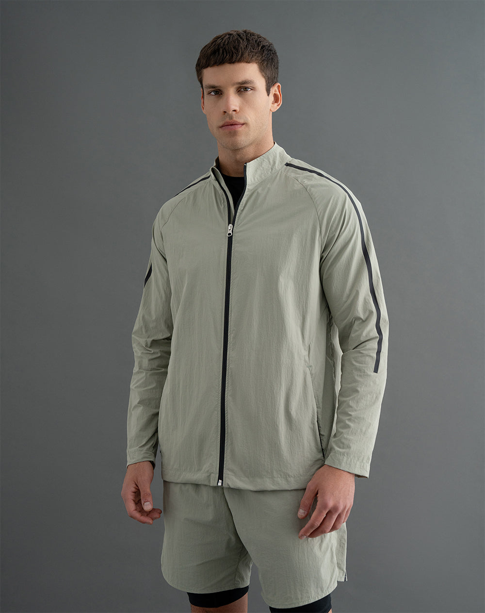 Chaqueta rompevientos sin capucha verde hombre