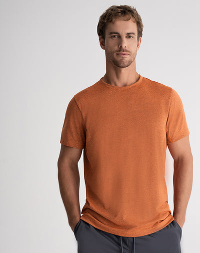 Camiseta deportiva hombre control humedad naranja