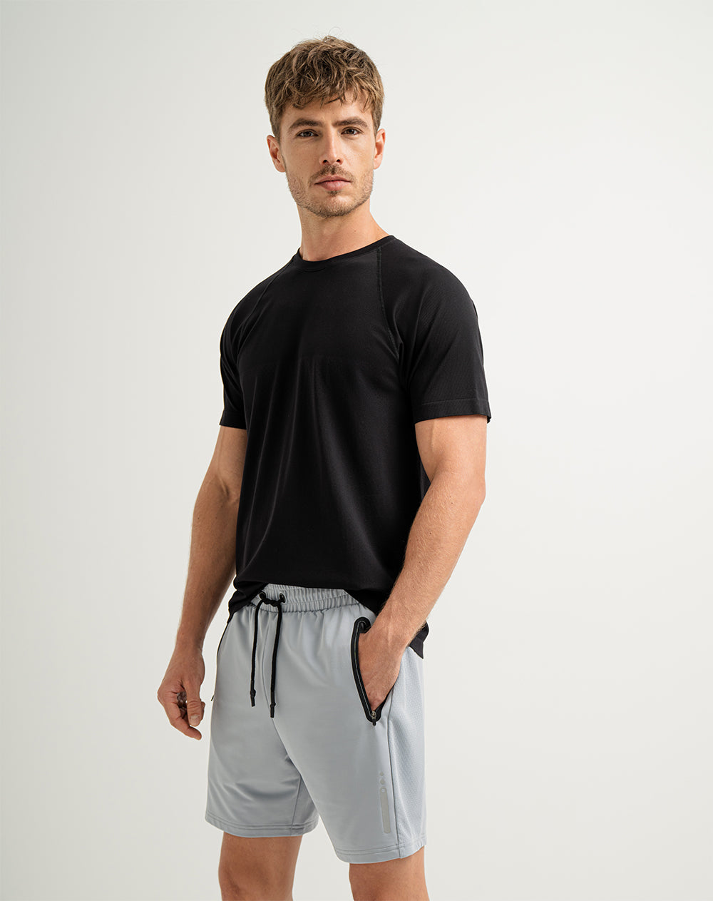 Pantaloneta deportiva control humedad gris para hombre