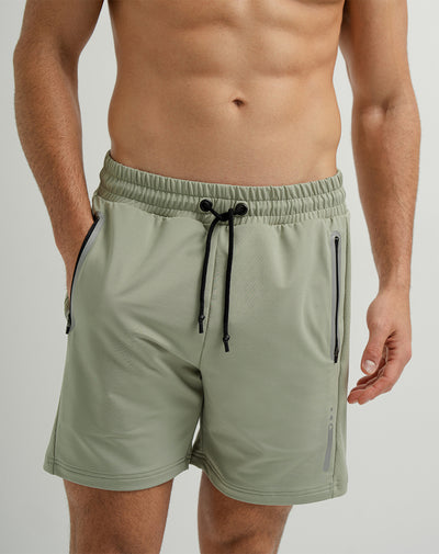 Pantaloneta deportiva control humedad verde hombre