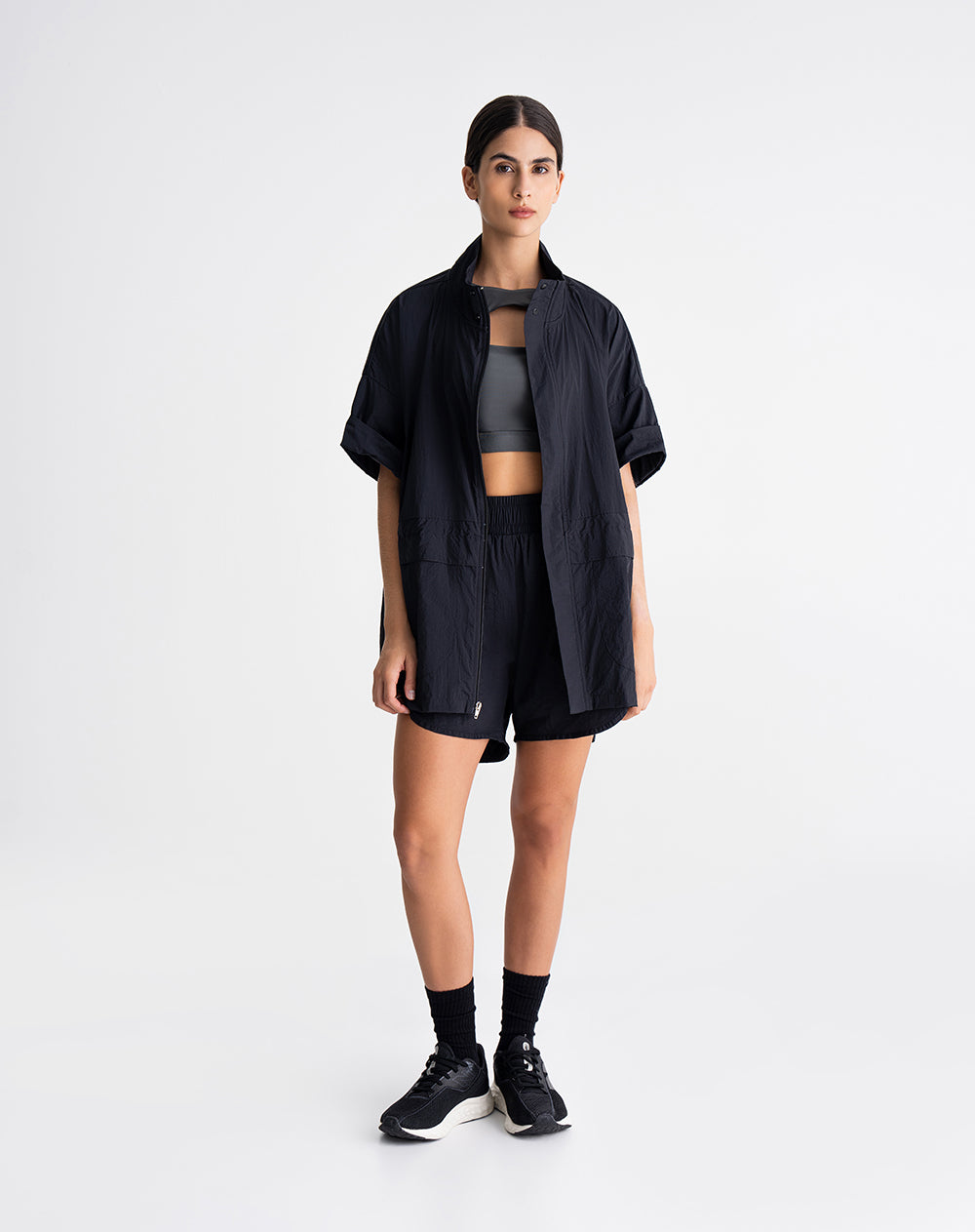 Chaleco rompevientos ajustable en cintura negro mujer