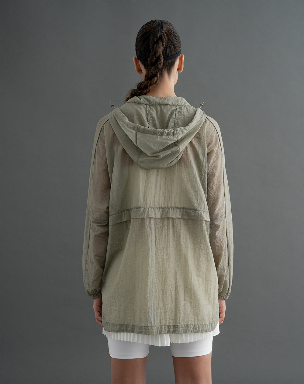 Chaqueta rompevientos con capucha verde para mujer