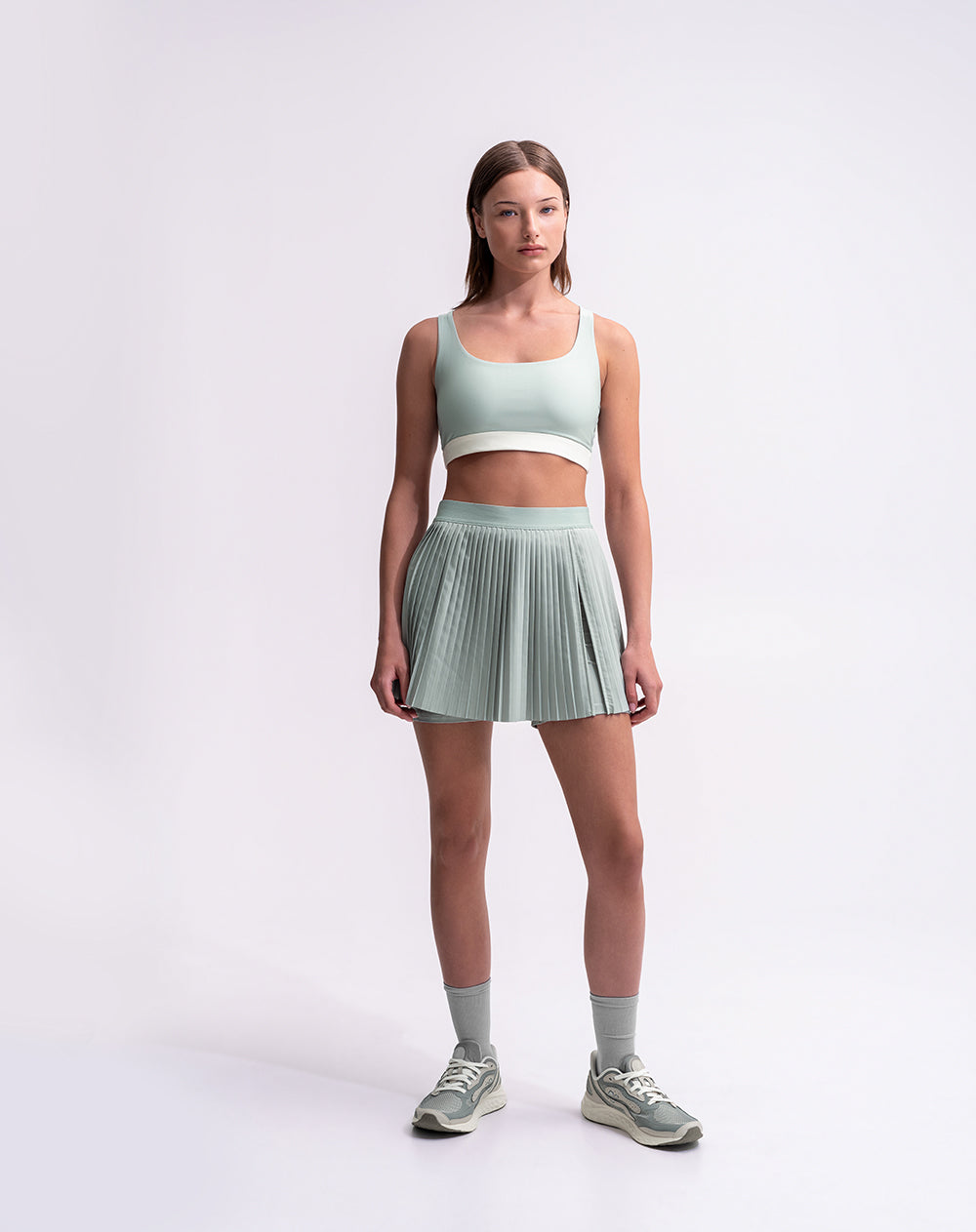 Top deportivo soporte medio control humedad verde