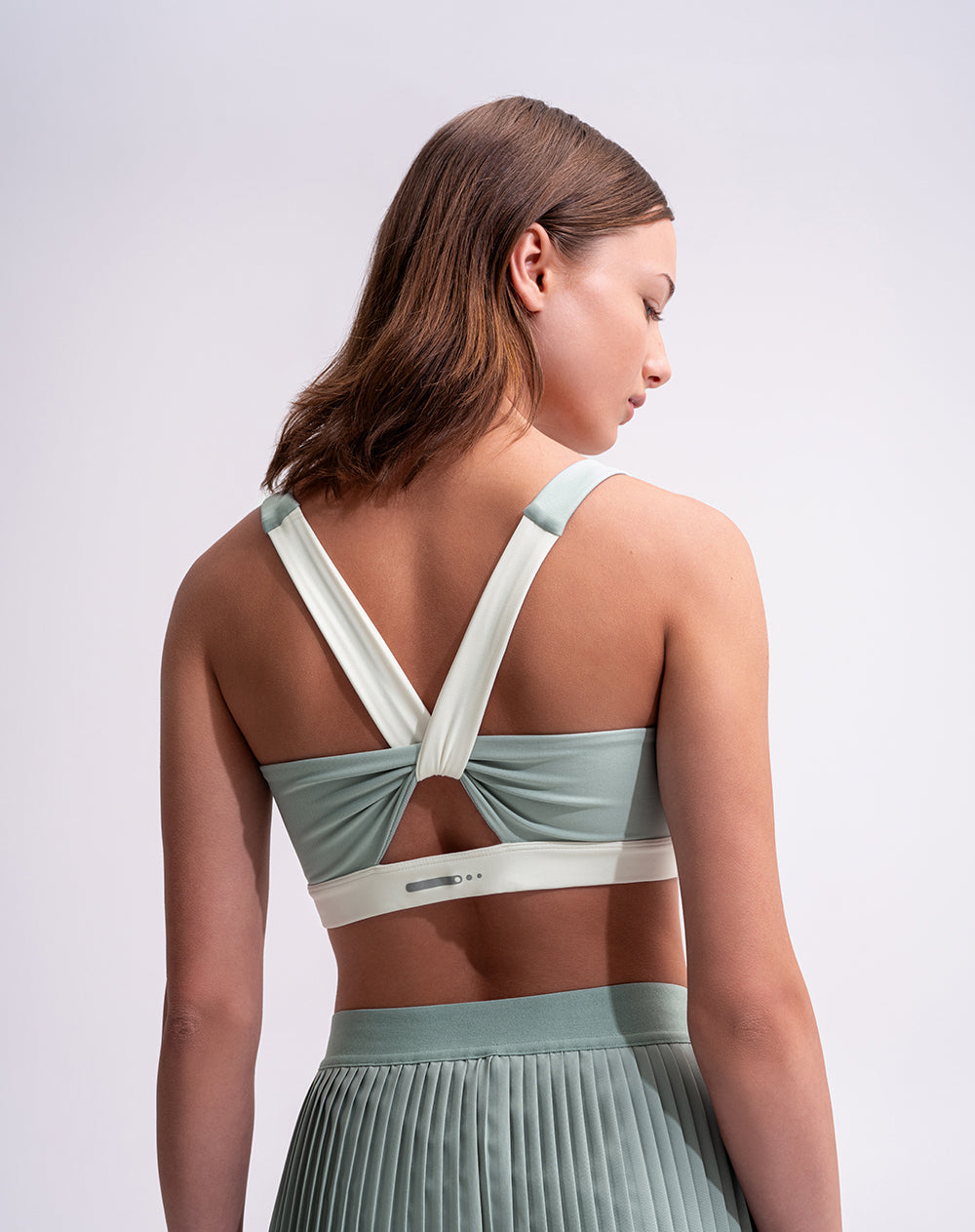 Top deportivo soporte medio control humedad verde