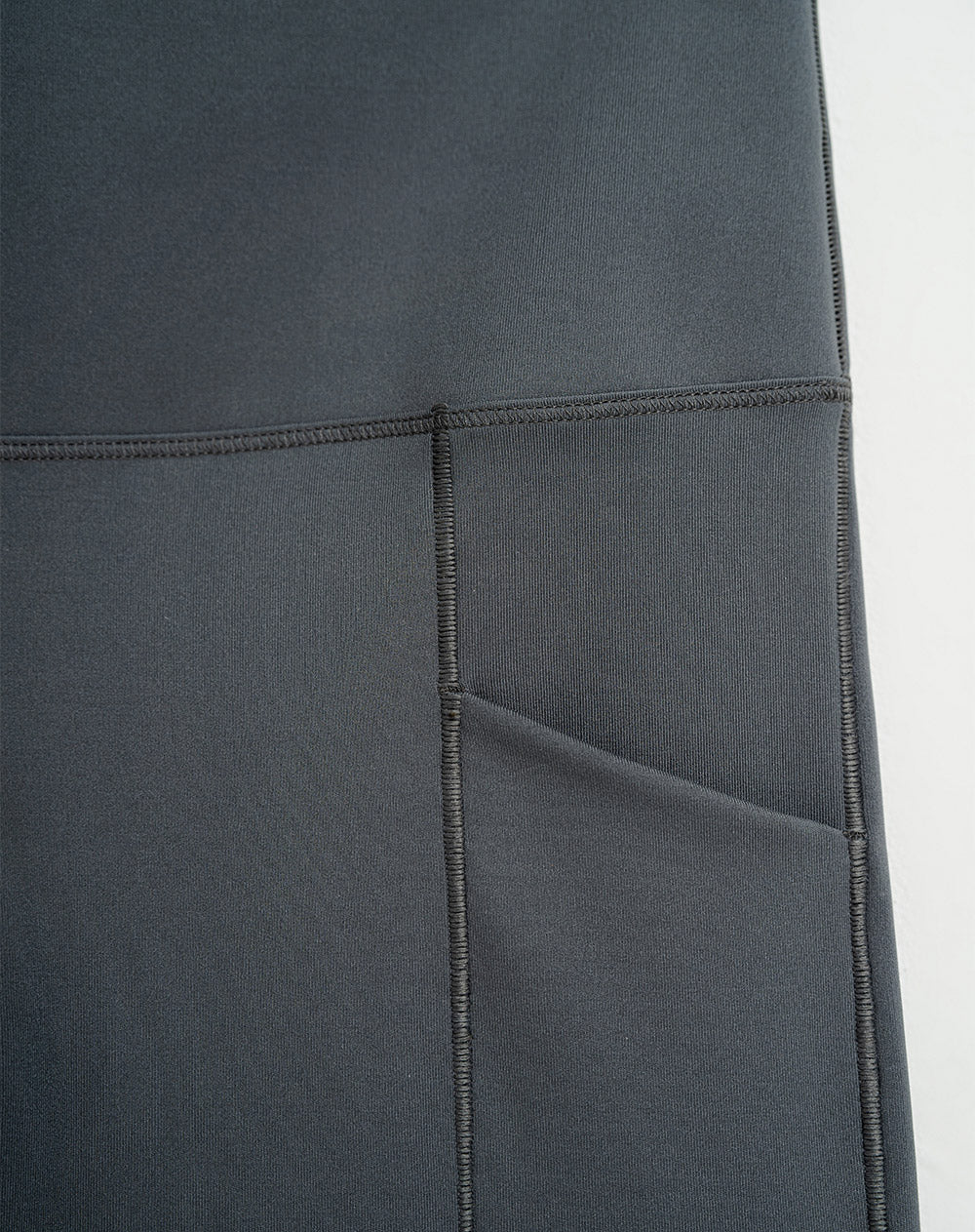 Legging deportivo bolsillos frontales gris para mujer