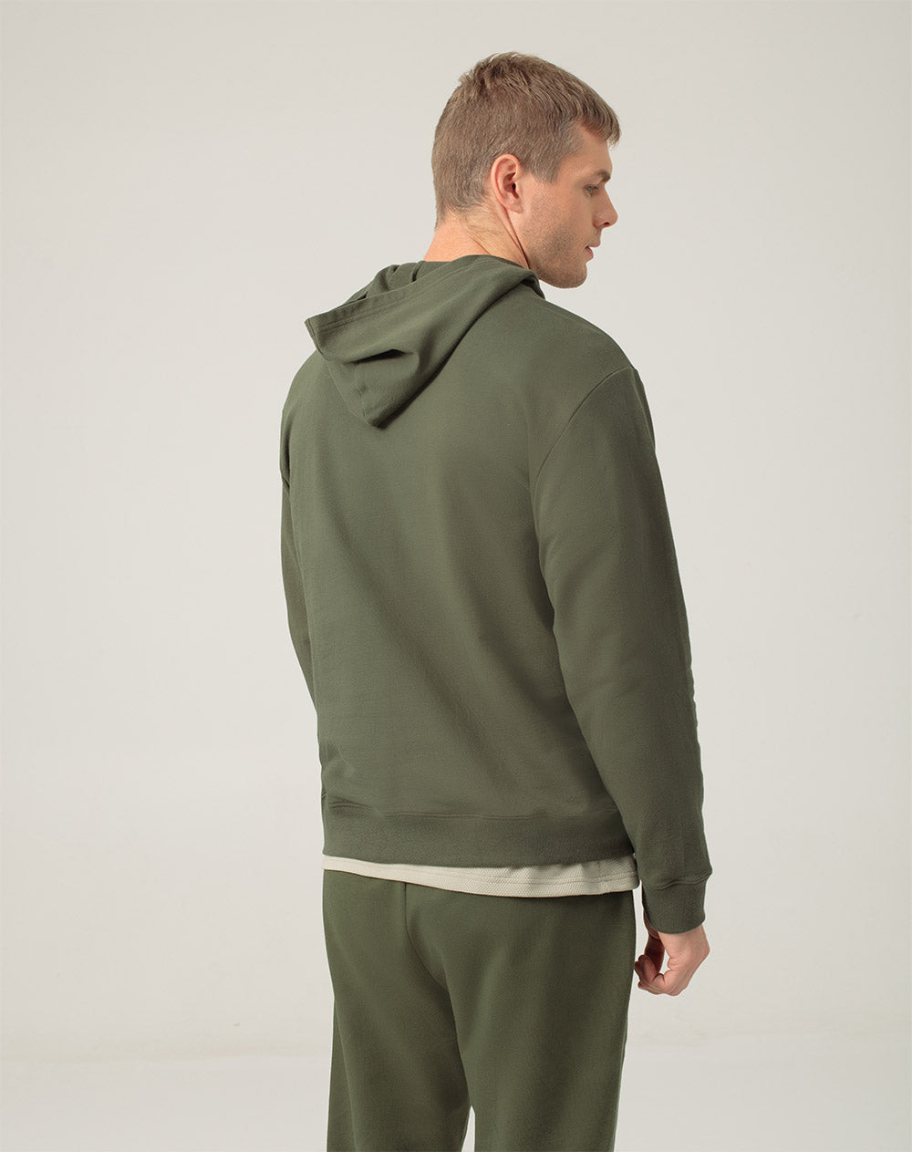 Buzo en algodón sostenible bolsillo frontal y capucha verde para hombre